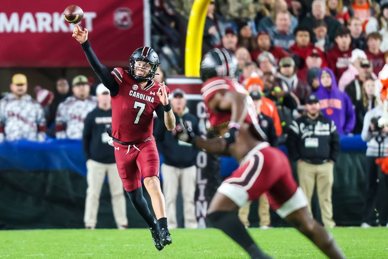 Nov 25, 2023; Columbia, South Carolina, USA; South Carolina Gamecocks quarterback Spencer Rattler (7) throws a pass against the Clemson Tigers in the first quarter at Williams-Brice Stadium. Mandatory Credit: Jeff Blake-USA TODAY Sports