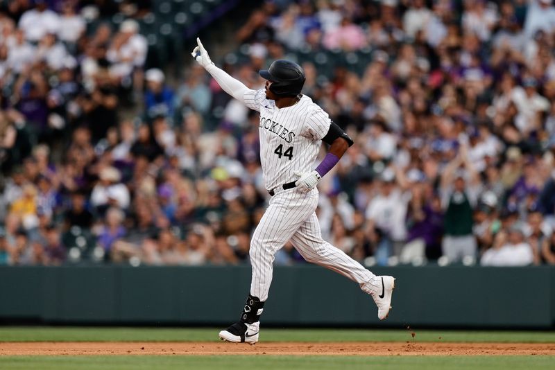 Jun 18, 2024; Denver, Colorado, USA; Colorado Rockies pinch hitter Elehuris Montero (44) gestures as he rounds the bases on a two run home run in the second inning against the Los Angeles Dodgers at Coors Field. Mandatory Credit: Isaiah J. Downing-USA TODAY Sports