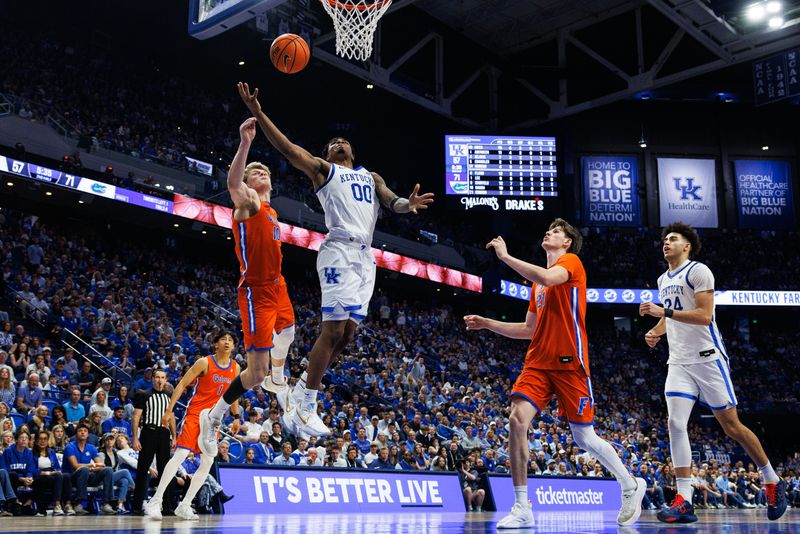 Mar 7, 2026; Lexington, Kentucky, USA; Kentucky Wildcats guard Otega Oweh (00) goes to the basket against Florida Gators forward Thomas Haugh (10) during the second half at Rupp Arena at Central Bank Center. Mandatory Credit: Jordan Prather-Imagn Images