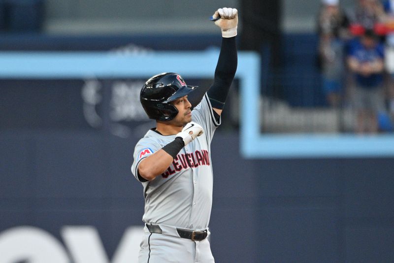 Jun 14, 2024; Toronto, Ontario, CAN;  Cleveland Guardians left fielder Steven Kwan (38) reacts after hitting a double against the Toronto Blue Jays in the first inning at Rogers Centre. Mandatory Credit: Dan Hamilton-USA TODAY Sports