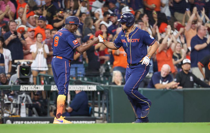 Sep 18, 2023; Houston, Texas, USA; Houston Astros first baseman Jose Abreu (79) celebrates with third base coach Gary Pettis (8) after hitting a home run during the seventh inning against the Baltimore Orioles at Minute Maid Park. Mandatory Credit: Troy Taormina-USA TODAY Sports