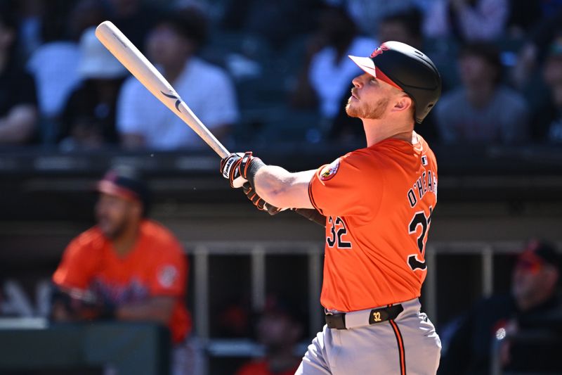 May 25, 2024; Chicago, Illinois, USA;  Baltimore Orioles infielder Ryan O'Hearn (32) hits a two-run home run in the eighth inning against the Chicago White Sox at Guaranteed Rate Field. Mandatory Credit: Jamie Sabau-USA TODAY Sports