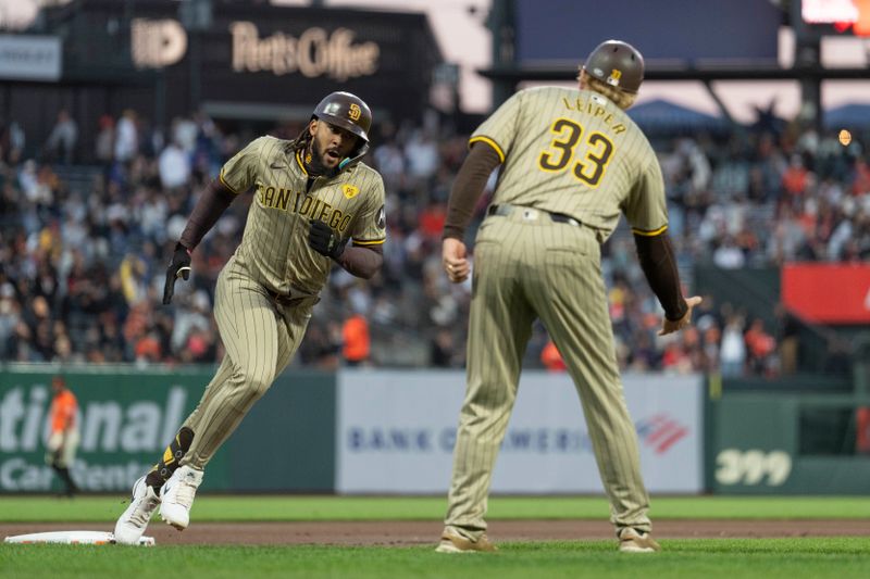 Sep 13, 2024; San Francisco, California, USA;  San Diego Padres outfielder Fernando Tatis Jr. (23) rounds third base after hitting a two run homerun during the first inning against the San Francisco Giants at Oracle Park. Mandatory Credit: Stan Szeto-Imagn Images
