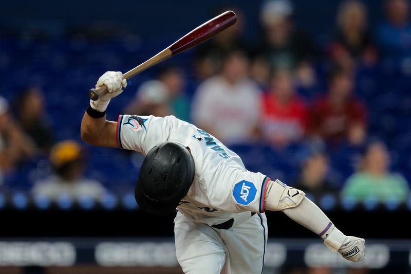 Jun 4, 2025; Miami, Florida, USA; Miami Marlins second baseman Javier Sanoja (46) throws his bat after his at bat against the Colorado Rockies during the sixth inning at loanDepot Park. Mandatory Credit: Sam Navarro-Imagn Images