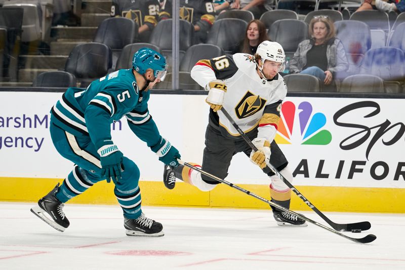 Sep 21, 2025; San Jose, California, USA; Vegas Golden Knights right wing Jonas Rondbjerg (46) plays the puck against San Jose Sharks defenseman Vincent Desharnais (5) during the first period at SAP Center at San Jose. Mandatory Credit: Robert Edwards-Imagn Images