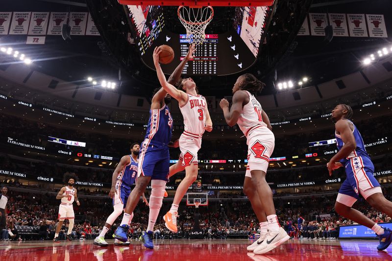 CHICAGO, ILLINOIS - DECEMBER 08: Josh Giddey #3 of the Chicago Bulls goes up for a layup against the Philadelphia 76ers during the first half at the United Center on December 08, 2024 in Chicago, Illinois. NOTE TO USER: User expressly acknowledges and agrees that, by downloading and or using this photograph, User is consenting to the terms and conditions of the Getty Images License Agreement.  (Photo by Michael Reaves/Getty Images)