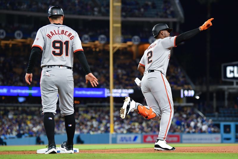 Apr 3, 2024; Los Angeles, California, USA; San Francisco Giants designated hitter Jorge Soler (2) reacts after hitting a solo home run against the Los Angeles Dodgers during the eighth inning at Dodger Stadium. Mandatory Credit: Gary A. Vasquez-USA TODAY Sports