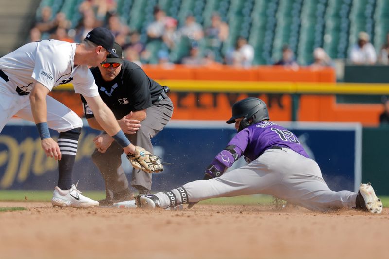 Sep 12, 2024; Detroit, Michigan, USA;  Colorado Rockies outfielder Hunter Goodman (15) slides in safe at second after he hits a double in the seventh inning against the Detroit Tigers at Comerica Park. Mandatory Credit: Rick Osentoski-Imagn Images