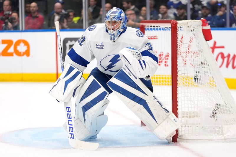 Oct 21, 2024; Toronto, Ontario, CAN; Tampa Bay Lightning goaltender Jonas Johansson (31) defends the goal against the Toronto Maple Leafs during the third period at Scotiabank Arena. Mandatory Credit: John E. Sokolowski-Imagn Images