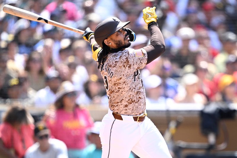 Jul 14, 2024; San Diego, California, USA; San Diego Padres pinch-hitter Luis Campusano (12) hits a two-run home run against the Atlanta Braves during the seventh inning at Petco Park. Mandatory Credit: Orlando Ramirez-USA TODAY Sports