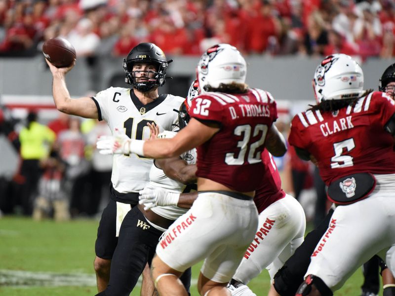 Nov 5, 2022; Raleigh, North Carolina, USA; Wake Forest Demon Deacons quarterback Sam Hartman (10) throws a pass during the first half against the North Carolina State Wolfpack at Carter-Finley Stadium. Mandatory Credit: Rob Kinnan-USA TODAY Sports