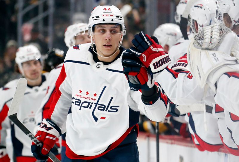 Jan 2, 2024; Pittsburgh, Pennsylvania, USA;  Washington Capitals defenseman Martin Fehervary (42) celebrates his goal with the Caps bench against the Pittsburgh Penguins during the first period at PPG Paints Arena. Mandatory Credit: Charles LeClaire-USA TODAY Sports