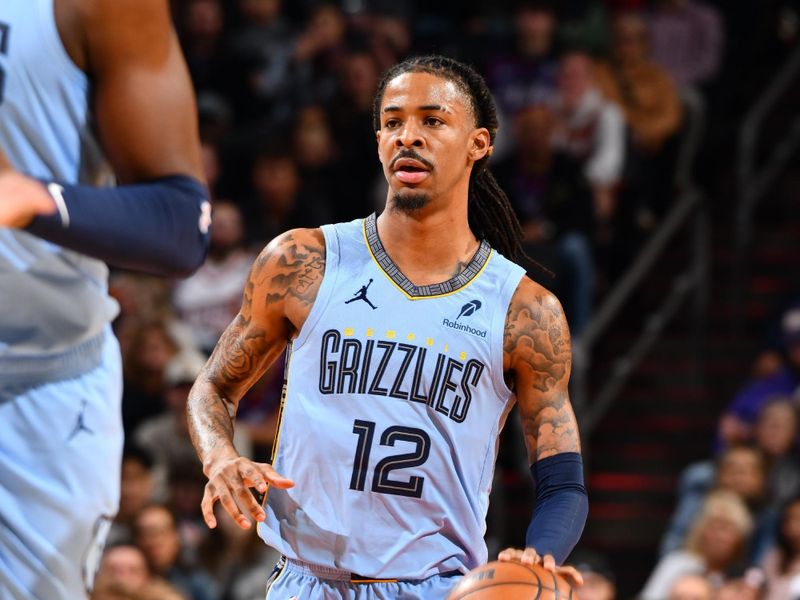 PHOENIX, AZ - FEBRUARY 11:  Ja Morant #12 of the Memphis Grizzlies dribbles the ball during the game against the Phoenix Suns on February 11, 2025 at Footprint Center in Phoenix, Arizona. NOTE TO USER: User expressly acknowledges and agrees that, by downloading and or using this photograph, user is consenting to the terms and conditions of the Getty Images License Agreement. Mandatory Copyright Notice: Copyright 2025 NBAE (Photo by Barry Gossage/NBAE via Getty Images)