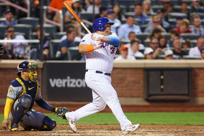 Jun 27, 2023; New York City, New York, USA; New York Mets designated hitter Daniel Vogelbach (32) hits a single during the fifth inning against the Milwaukee Brewers at Citi Field. Mandatory Credit: Vincent Carchietta-USA TODAY Sports