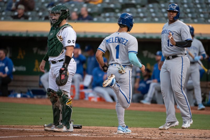 Aug 22, 2023; Oakland, California, USA; Kansas City Royals designated hitter MJ Melendez (1) scores during the second inning against the Oakland Athletics at Oakland-Alameda County Coliseum. Mandatory Credit: Ed Szczepanski-USA TODAY Sports