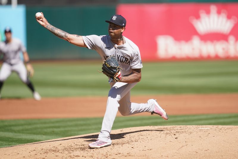 Sep 22, 2024; Oakland, California, USA; New York Yankees pitcher Luis Gil (81) delivers a pitch against the Oakland Athletics in the first inning at the Oakland-Alameda County Coliseum. Mandatory Credit: Cary Edmondson-Imagn Images