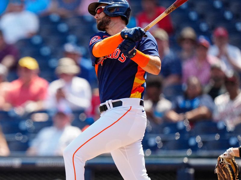 Mar 12, 2023; West Palm Beach, Florida, USA; Houston Astros designated hitter David Hensley (17) hits a single against the Miami Marlins during the first inning at The Ballpark of the Palm Beaches. Mandatory Credit: Rich Storry-USA TODAY Sports