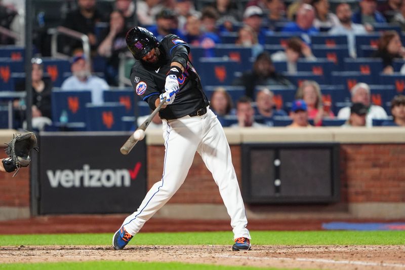 May 31, 2024; New York City, New York, USA; New York Mets designated hitter JD Martinez (28) hits a two-run home run against the Arizona Diamondbacks during the sixth inning at Citi Field. Mandatory Credit: Gregory Fisher-USA TODAY Sports