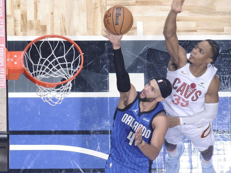 ORLANDO, FL - APRIL 25: Jalen Suggs #4 of the Orlando Magic goes to the basket during the game against the Cleveland Cavaliers during Round 1 Game 3 of the 2024 NBA Playoffs on April 25, 2024 at Kia Center in Orlando, Florida. NOTE TO USER: User expressly acknowledges and agrees that, by downloading and or using this photograph, User is consenting to the terms and conditions of the Getty Images License Agreement. Mandatory Copyright Notice: Copyright 2023 NBAE (Photo by Fernando Medina/NBAE via Getty Images)