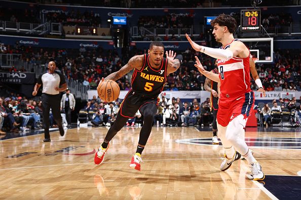 WASHINGTON, DC -? DECEMBER 31: Dejounte Murray #5 of the Atlanta Hawks dribbles the ball during the game against the Washington Wizards on December 31, 2023 at Capital One Arena in Washington, DC. NOTE TO USER: User expressly acknowledges and agrees that, by downloading and or using this Photograph, user is consenting to the terms and conditions of the Getty Images License Agreement. Mandatory Copyright Notice: Copyright 2023 NBAE (Photo by Kenny Giarla/NBAE via Getty Images)