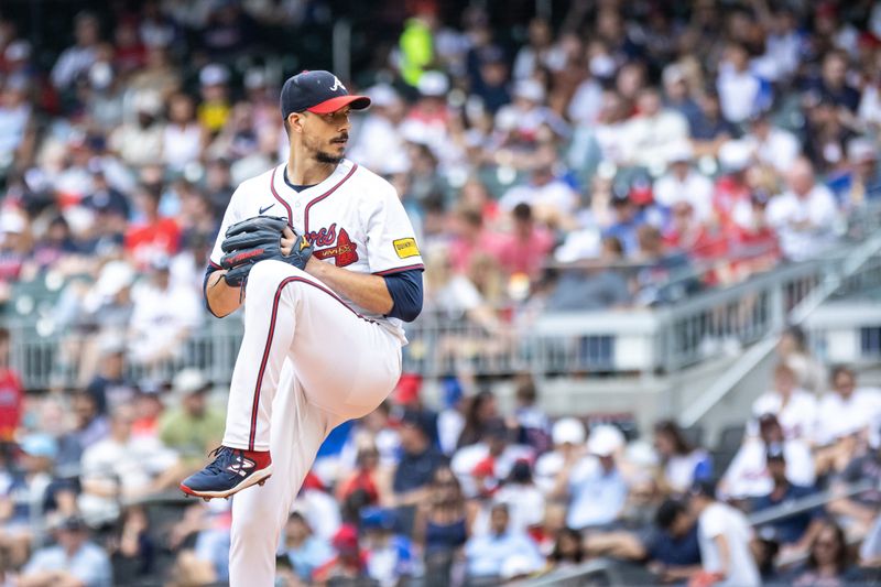 Sep 29, 2024; Cumberland, Georgia, USA; Atlanta Braves pitcher Charlie Morton (50) pitches the ball against the Kansas City Royals during the second inning at Truist Park. Mandatory Credit: Jordan Godfree-Imagn Images