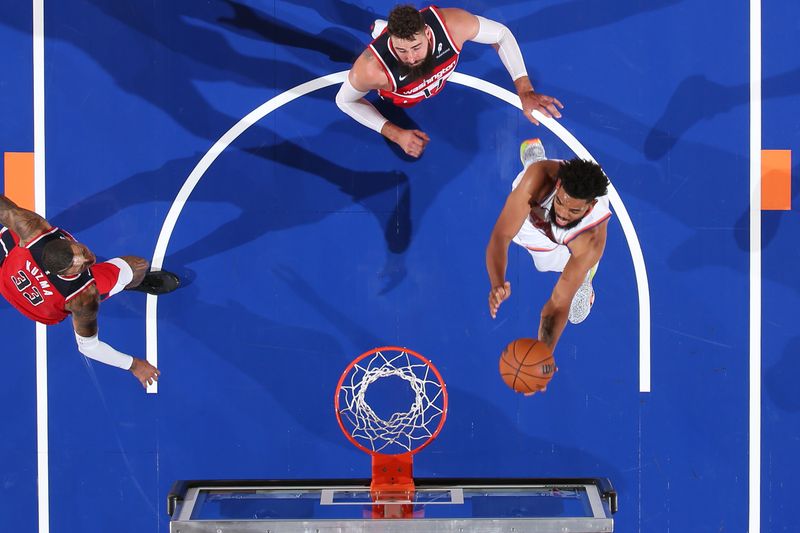 NEW YORK, NY - OCTOBER 9: Karl-Anthony Towns #32 of the New York Knicks drives to the basket during the game against the Washington Wizards during the 2024 NBA Preseason on October 9, 2024 at Madison Square Garden in New York City, New York.  NOTE TO USER: User expressly acknowledges and agrees that, by downloading and or using this photograph, User is consenting to the terms and conditions of the Getty Images License Agreement. Mandatory Copyright Notice: Copyright 2024 NBAE  (Photo by Nathaniel S. Butler/NBAE via Getty Images)