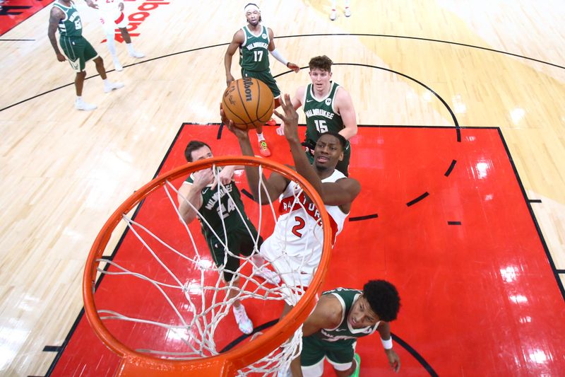 TORONTO, CANADA - JANUARY 6: Jonathan Mogbo #2 of the Toronto Raptors drives to the basket during the game against the Milwaukee Bucks on January 6, 2025 at the Scotiabank Arena in Toronto, Ontario, Canada.  NOTE TO USER: User expressly acknowledges and agrees that, by downloading and or using this Photograph, user is consenting to the terms and conditions of the Getty Images License Agreement.  Mandatory Copyright Notice: Copyright 2025 NBAE (Photo by Vaughn Ridley/NBAE via Getty Images)