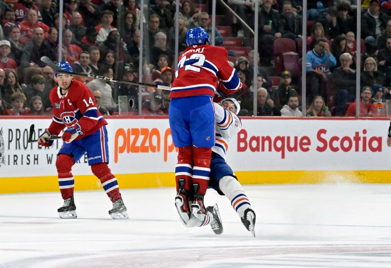 Nov 18, 2024; Montreal, Quebec, CAN; Montreal Canadiens defenseman Arber Xhekaj (72) hits Edmonton Oilers forward Zach Hyman (18) during the first period at the Bell Centre. Mandatory Credit: Eric Bolte-Imagn Images