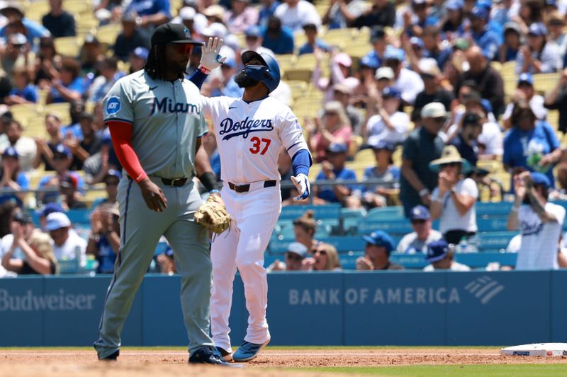 May 8, 2024; Los Angeles, California, USA;  Los Angeles Dodgers outfielder Teoscar Hernandez (37) reacts after hitting an RBI single during the first inning against the Miami Marlins at Dodger Stadium. Mandatory Credit: Kiyoshi Mio-USA TODAY Sports