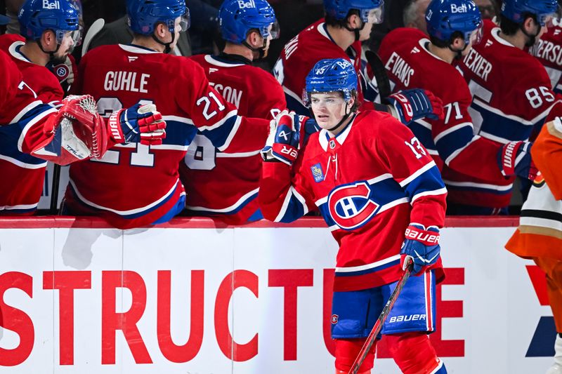 Mar 15, 2026; Montreal, Quebec, CAN; Montreal Canadiens right wing Cole Caufield (13) celebrates with his teammates at the bench his goal against the Anaheim Ducks during the second period at Bell Centre. Mandatory Credit: David Kirouac-Imagn Images