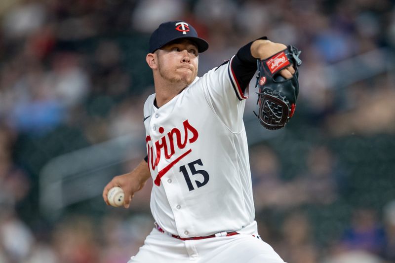 May 23, 2023; Minneapolis, Minnesota, USA; Minnesota Twins relief pitcher Emilio Pagan (15) delivers a pitch in the ninth inning against the San Francisco Giants at Target Field. Mandatory Credit: Jesse Johnson-USA TODAY Sports