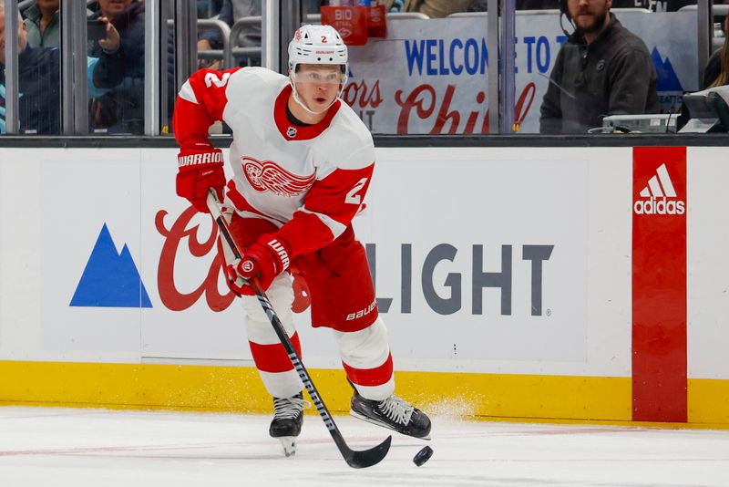 Feb 19, 2024; Seattle, Washington, USA; Detroit Red Wings defenseman Olli Maatta (2) skates with the puck against the Seattle Kraken during the first period at Climate Pledge Arena. Mandatory Credit: Joe Nicholson-USA TODAY Sports