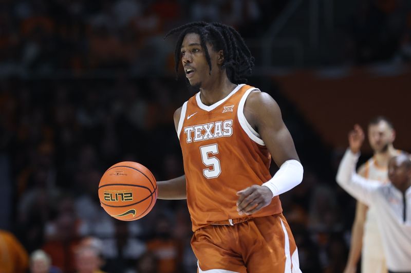 Jan 28, 2023; Knoxville, Tennessee, USA; Texas Longhorns guard Marcus Carr (5) brings the ball up court against the Tennessee Volunteers during the second half at Thompson-Boling Arena. Mandatory Credit: Randy Sartin-USA TODAY Sports