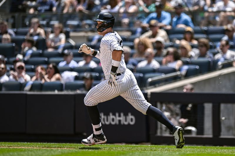 May 27, 2023; Bronx, New York, USA; New York Yankees center fielder Aaron Judge (99) heads to first base after hitting a single against the San Diego Padres during the first inning at Yankee Stadium. Mandatory Credit: John Jones-USA TODAY Sports