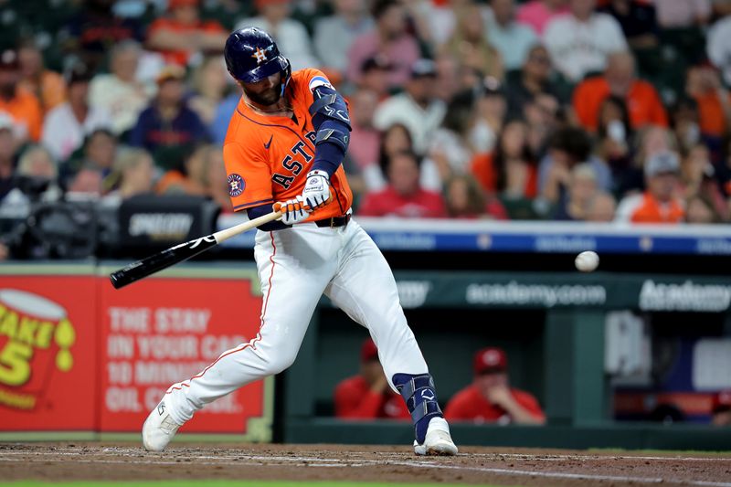 May 9, 2025; Houston, Texas, USA; Houston Astros first baseman Christian Walker (8) hits a double against the Cincinnati Reds during the second inning at Daikin Park. Mandatory Credit: Erik Williams-Imagn Images