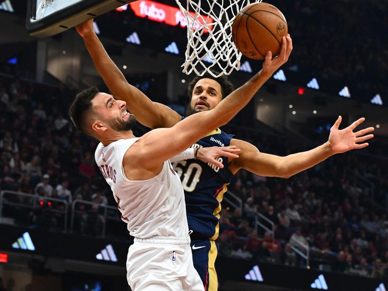 CLEVELAND, OHIO - DECEMBER 21: Max Strus #1 of the Cleveland Cavaliers shoots over Jeremiah Robinson-Earl #50 of the New Orleans Pelicans during the second quarter at Rocket Mortgage Fieldhouse on December 21, 2023 in Cleveland, Ohio. NOTE TO USER: User expressly acknowledges and agrees that, by downloading and or using this photograph, User is consenting to the terms and conditions of the Getty Images License Agreement. (Photo by Jason Miller/Getty Images)