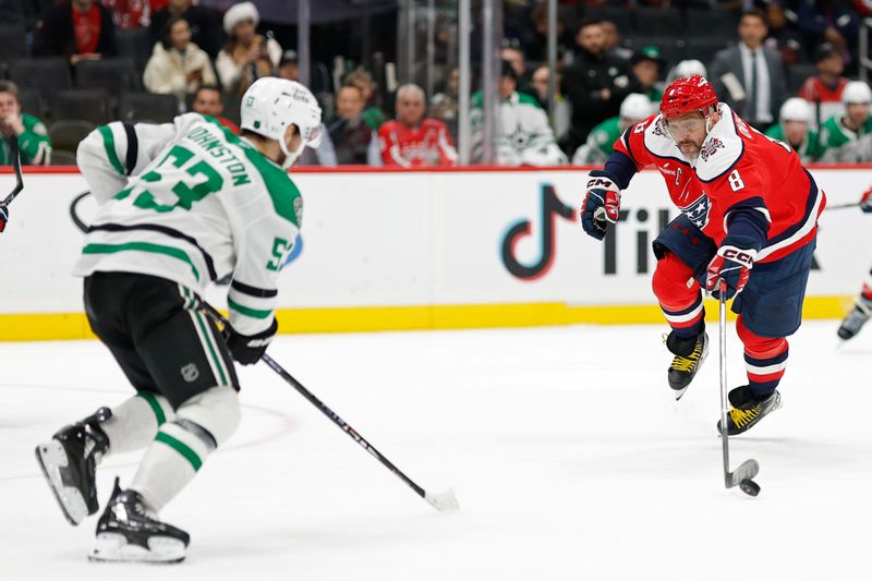 Jan 7, 2026; Washington, District of Columbia, USA; Washington Capitals left wing Alex Ovechkin (8) reaches for the puck as Dallas Stars center Wyatt Johnston (53) defends during the third period at Capital One Arena. Mandatory Credit: Geoff Burke-Imagn Images