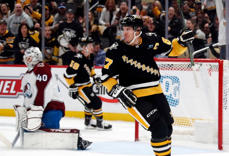 Oct 26, 2023; Pittsburgh, Pennsylvania, USA; Pittsburgh Penguins center Sidney Crosby (87) reacts after scoring a goal against Colorado Avalanche goaltender Alexandar Georgiev (40) during the third period at PPG Paints Arena. The Penguins shutout the Avalanche 4-0. Mandatory Credit: Charles LeClaire-USA TODAY Sports