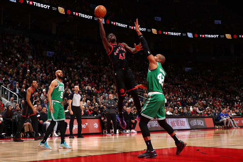 TORONTO, CANADA - JANUARY 15:  Pascal Siakam #43 of the Toronto Raptors drives to the basket during the game against the Boston Celtics on January 15, 2024 at the Scotiabank Arena in Toronto, Ontario, Canada.  NOTE TO USER: User expressly acknowledges and agrees that, by downloading and or using this Photograph, user is consenting to the terms and conditions of the Getty Images License Agreement.  Mandatory Copyright Notice: Copyright 2024 NBAE (Photo by Vaughn Ridley/NBAE via Getty Images)