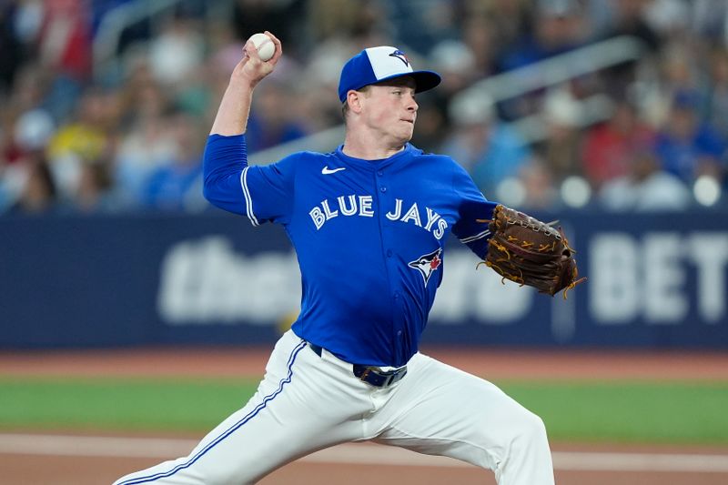 Sep 25, 2025; Toronto, Ontario, CAN; Toronto Blue Jays starting pitcher Louie Varland (77) pitches to the Boston Red Sox during the first inning at Rogers Centre. Mandatory Credit: John E. Sokolowski-Imagn Images