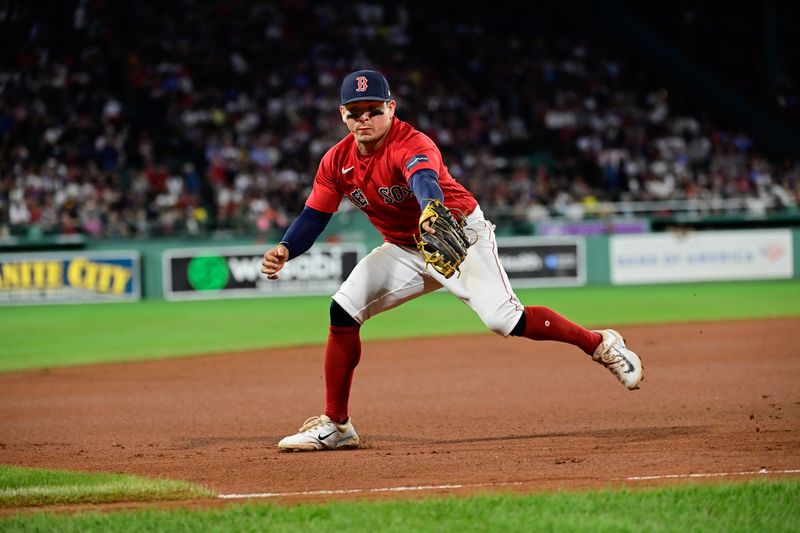 Sep 14, 2023; Boston, Massachusetts, USA; Boston Red Sox third baseman Luis Urias (17) catches a ground ball during the eighth inning against the New York Yankees at Fenway Park. Mandatory Credit: Eric Canha-USA TODAY Sports