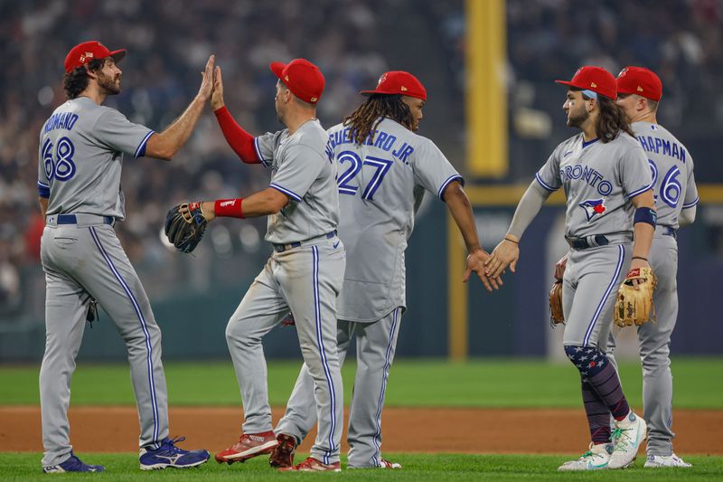 Jul 4, 2023; Chicago, Illinois, USA; Toronto Blue Jays players celebrate team's win against the Chicago White Sox at Guaranteed Rate Field. Mandatory Credit: Kamil Krzaczynski-USA TODAY Sports