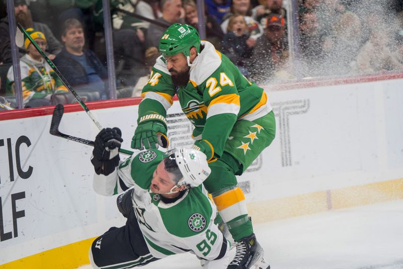 Nov 16, 2024; Saint Paul, Minnesota, USA; Minnesota Wild defenseman Zach Bogosian (24) checks Dallas Stars center Matt Duchene (95) in the second period at Xcel Energy Center. Mandatory Credit: Matt Blewett-Imagn Images