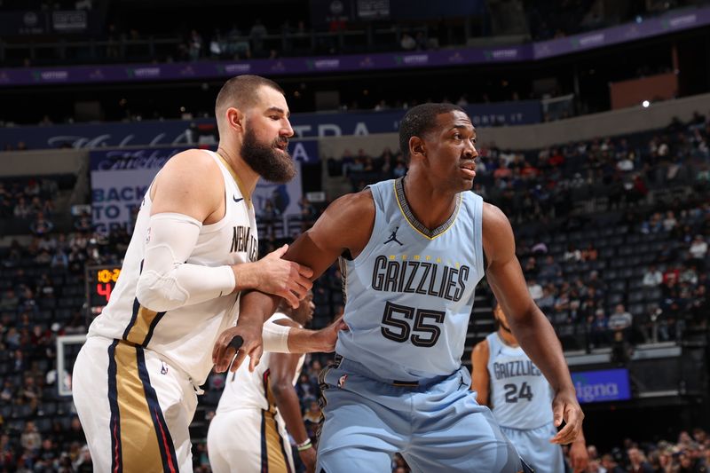 MEMPHIS, TN - FEBRUARY 12: Jonas Valanciunas #17 of the New Orleans Pelicans and Trey Jamison #55 of the Memphis Grizzlies battle for position during the game on February 12, 2024 at FedExForum in Memphis, Tennessee. NOTE TO USER: User expressly acknowledges and agrees that, by downloading and or using this photograph, User is consenting to the terms and conditions of the Getty Images License Agreement. Mandatory Copyright Notice: Copyright 2024 NBAE (Photo by Joe Murphy/NBAE via Getty Images)