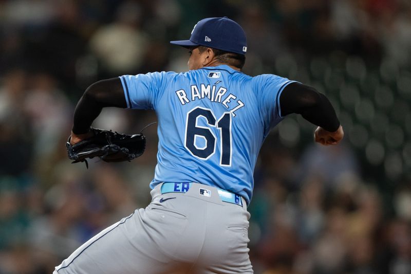 Aug 26, 2024; Seattle, Washington, USA; Tampa Bay Rays reliever Erasmot Ramirez delivers a pitch during the eighth inning against the Seattle Mariners at T-Mobile Park. Mandatory Credit: Stephen Brashear-USA TODAY Sports