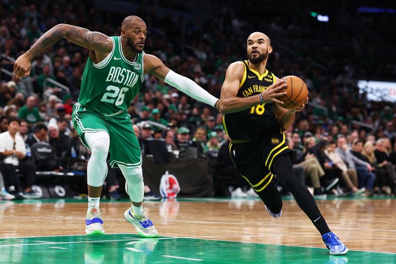 BOSTON, MASSACHUSETTS - MARCH 03: Jerome Robinson #18 of the Golden State Warriors drives to the basket against Xavier Tillman #26 of the Boston Celtics during the second half at TD Garden on March 03, 2024 in Boston, Massachusetts. The Celtics defeat the Warriors 140-88. NOTE TO USER: User expressly acknowledges and agrees that, by downloading and or using this photograph, user is consenting to the terms and conditions of the Getty Images License Agreement.  (Photo by Maddie Meyer/Getty Images)