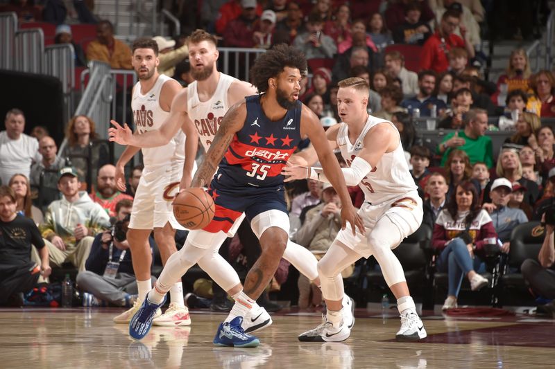 CLEVELAND, OH - DECEMBER 13: Marvin Bagley III #35 of the Washington Wizards handles the ball during the game against the Cleveland Cavaliers on December 13, 2024 at Rocket Mortgage FieldHouse in Cleveland, Ohio. NOTE TO USER: User expressly acknowledges and agrees that, by downloading and/or using this Photograph, user is consenting to the terms and conditions of the Getty Images License Agreement. Mandatory Copyright Notice: Copyright 2024 NBAE (Photo by David Liam Kyle/NBAE via Getty Images)