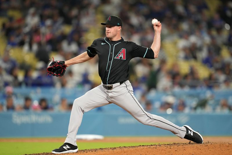 May 21, 2024; Los Angeles, California, USA; Arizona Diamondbacks pitcher Joe Mantiply (35) throws in the eighth inning against the Los Angeles Dodgers at Dodger Stadium. Mandatory Credit: Kirby Lee-USA TODAY Sports