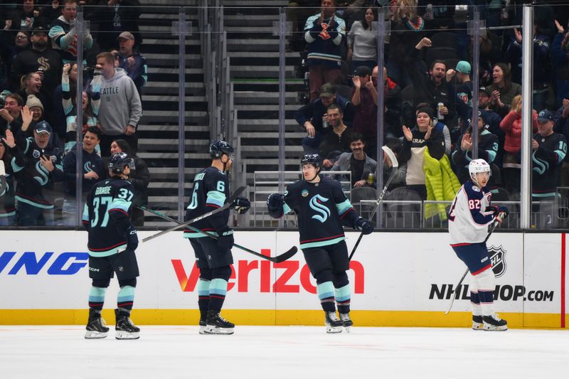 Nov 12, 2024; Seattle, Washington, USA; Seattle Kraken left wing Tye Kartye (12) celebrates after scoring a goal against the Columbus Blue Jackets during the second period at Climate Pledge Arena. Mandatory Credit: Steven Bisig-Imagn Images