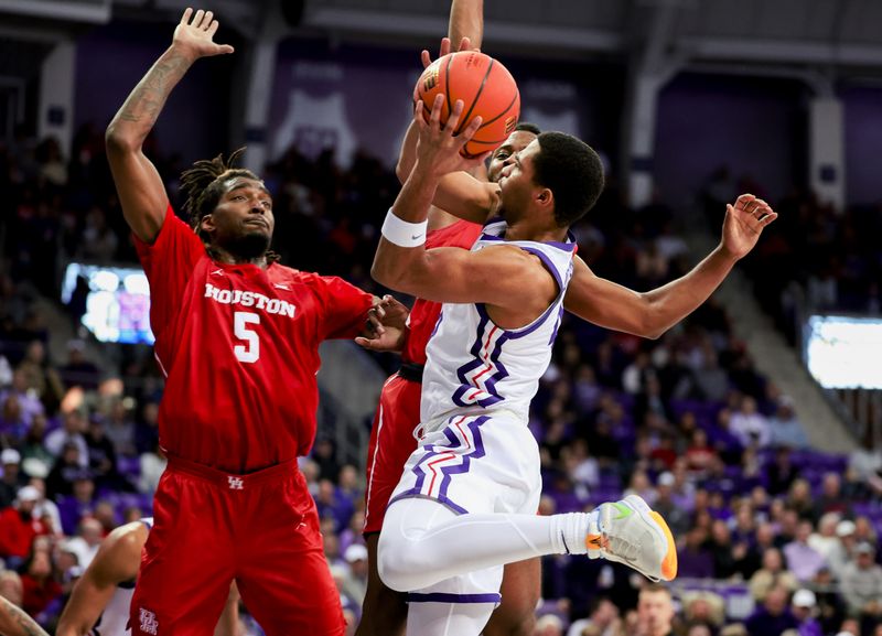 Jan 13, 2024; Fort Worth, Texas, USA; TCU Horned Frogs guard Jameer Nelson Jr. (4) shoots as Houston Cougars forward Ja'Vier Francis (5) defends during the first half  at Ed and Rae Schollmaier Arena. Mandatory Credit: Kevin Jairaj-USA TODAY Sports